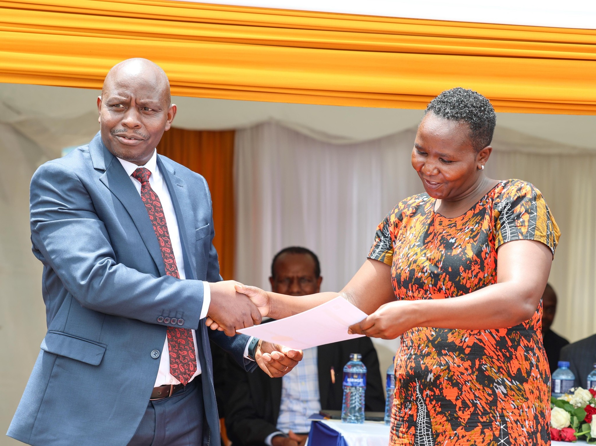 Rep of State Department for Road issuing a registration certificate to one of the applicant